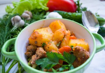 meat dish on green and white ceramic bowl